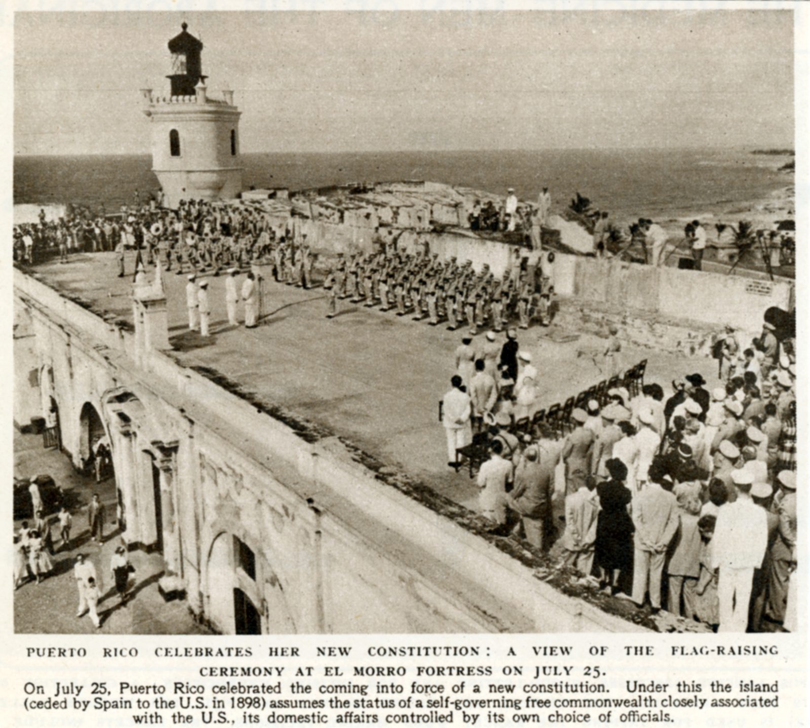 Flag-raising ceremony at El Morro fortress, San Juan, July 25, 1952, with crowds along the walls